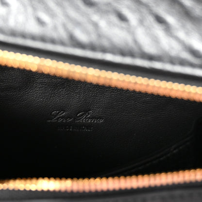 Close-up of black leather interior lining with Loro Piana logo and gold-tone zipper track