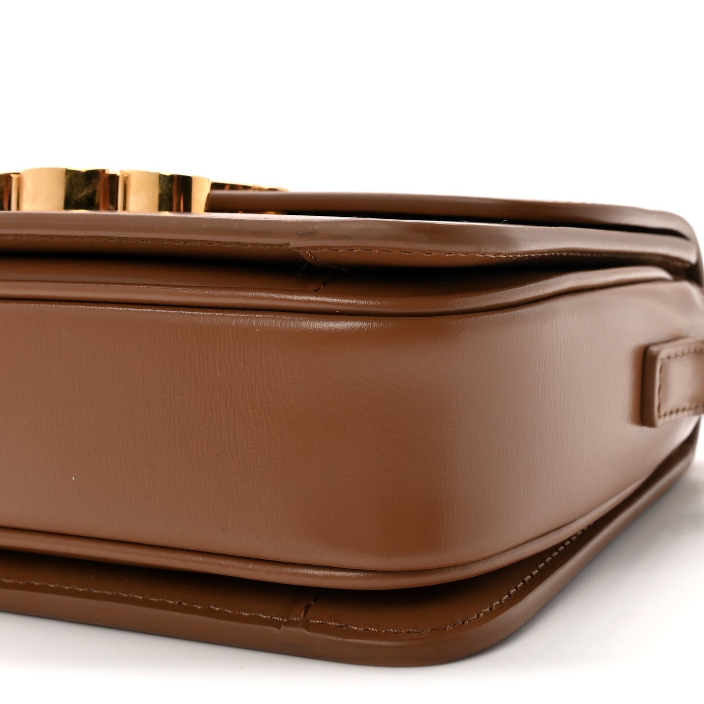 Calfskin bag side profile with flap edge and topstitching detail