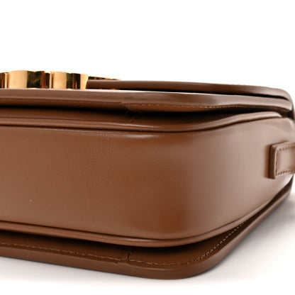 Calfskin bag side profile with flap edge and topstitching detail