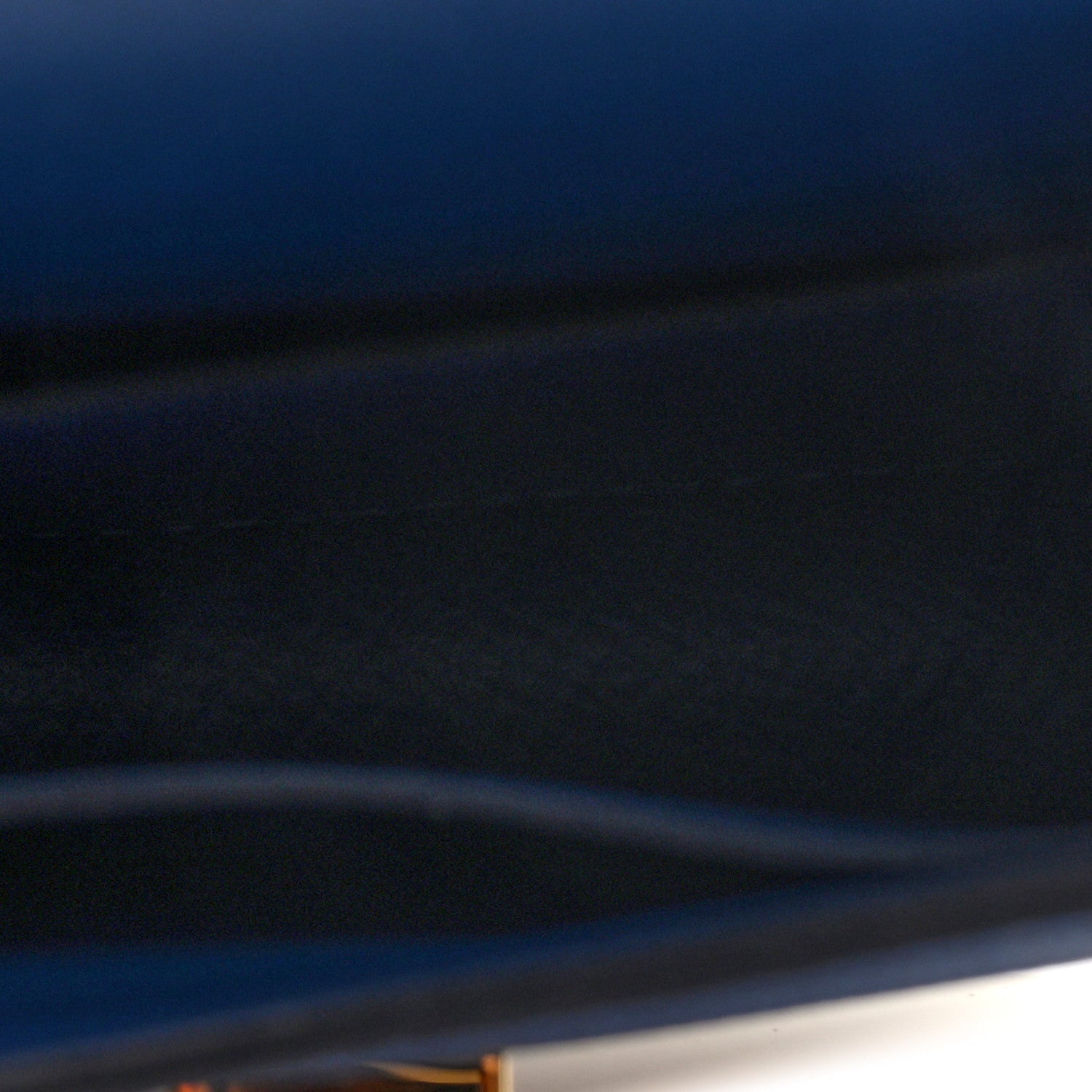 Blue leather wallet close-up of cover edge and smooth surface