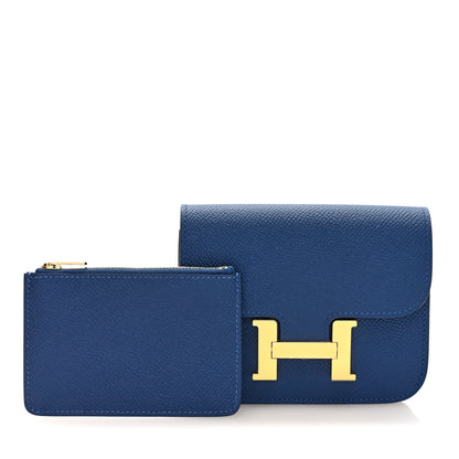 Blue slim wallet with matching card case and gold H logo clasp