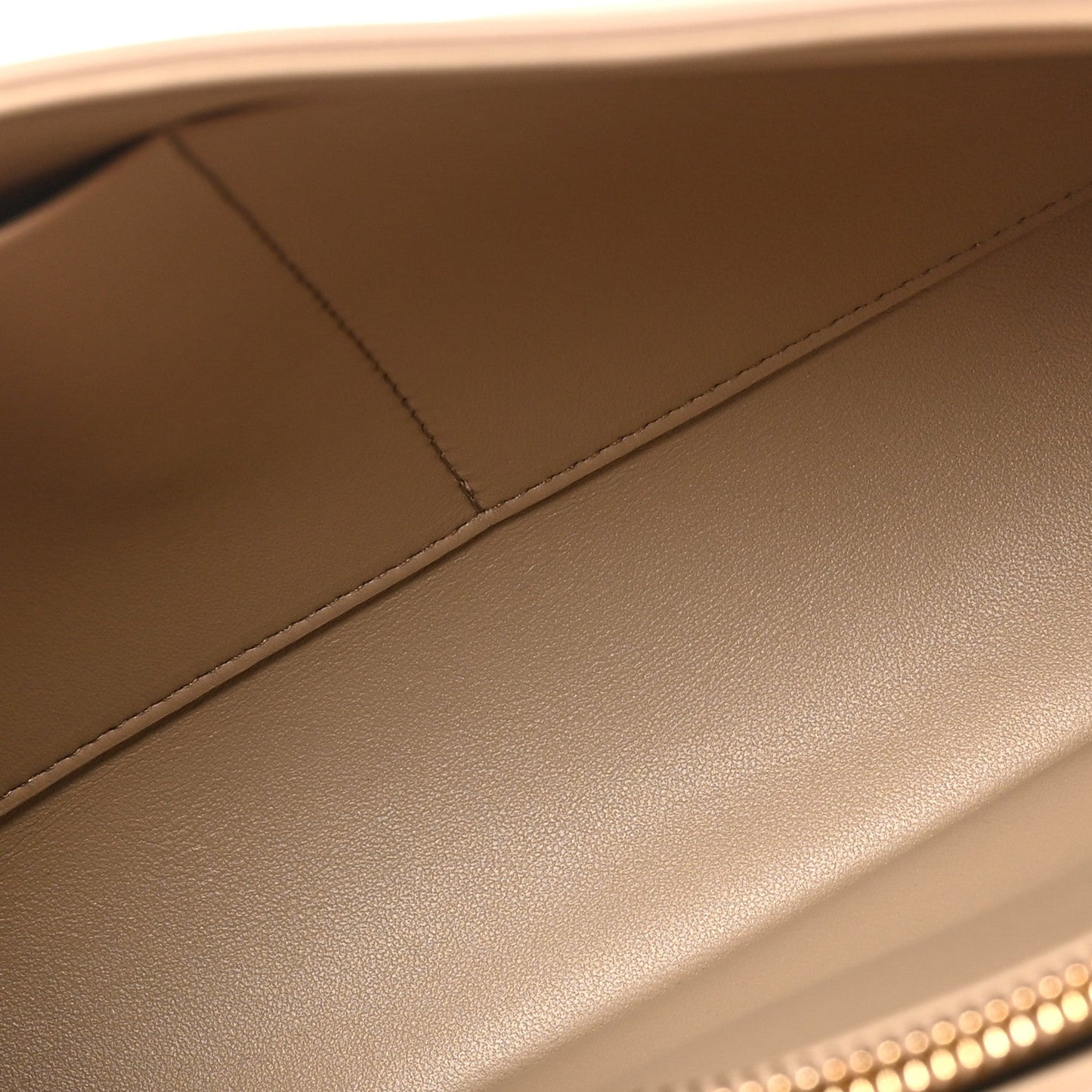 Beige grained leather interior edge with topstitching